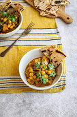 Butternut squash chickpea curry with coconut milk and fresh naan