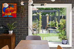 Picture window in dining area to garden