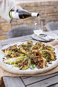 Grilled pointed cabbage with spring onion and raisins