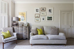 Patterned accent chair and gray sofa in the classic living room