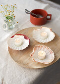 Tea candles in scallop shells
