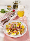 Bavarian dumpling salad with radishes and hard-boiled eggs