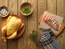 Raw corn-fed poulard and sliced chicken breast