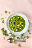 Cucumber soup with giant couscous and balsamic vinegar pearls