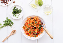 From above grated carrot salad on wooden table