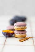 Homemade macarons with plum filling and cinnamon cream