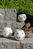 DIY flower lanterns on outdoor stone steps