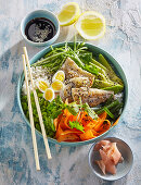 Poke bowl with trout and quail eggs