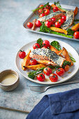 Roast salmon with sweet potatoes and vegetables