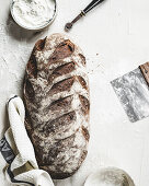 A long crusty loaf with a cloth