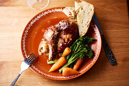 Half roast chicken with broccoli and carrots