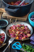 Red cabbage with chorizo, pears, and plums