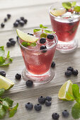 Gin mojito cocktails with blueberries