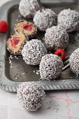 Raw Lamington Balls with raspberries