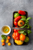 Colorful tomatoes in basket