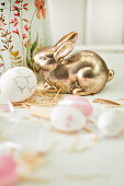 Golden Easter bunny and Easter eggs