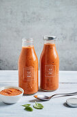 Homemade tomato sauce from roasted tomatoes in glass bottles