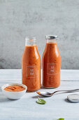 Homemade tomato sauce from roasted tomatoes in glass bottles