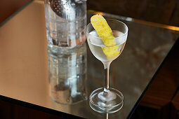 A martini with lemon peel