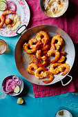 Fried prawns with pickled red onions (India)
