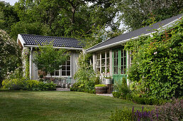 Large lawn in front of guest house and orangery