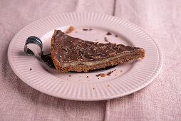 Vegan chocolate tart with a white and dark layer of chocolate