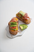Toasted bread with avocado, cheddar and oven-roasted tomatoes