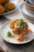Baked potatoes with herb and carrot dip