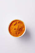 Ground turmeric in a small bowl