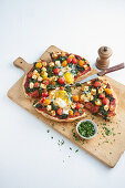 Quick flatbread pizza with spinach, egg, feta, and tomato sauce