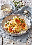 Sweet apricot filled dumplings with white chocolate shavings