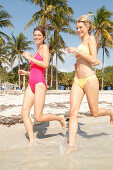 Friends jogging on the beach