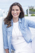 Young woman in white t-shirt and denim shirt