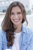 Young woman in white t-shirt and denim shirt