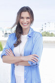 Young woman in white t-shirt and blue long blouse