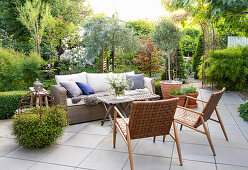 Comfortable seating area on the terrace made with concrete slabs