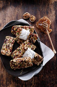 Homemade muesli bars made of dried fruit, nuts, and honey
