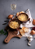 Vegan French onion soup, topped with almond cheese