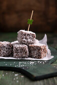 Vegan Cupavci - sponge cake cubes in a chocolate coconut coating
