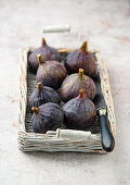 Fresh figs on a basket tray