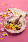 Smoked lamb shank with colorful carrots and rhubarb chutney
