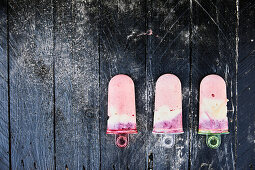 Homemade berry yoghurt ice creams on sticks