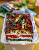 Terrine with feta cheese, aubergine and asparagus