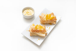 Puff pastry with rum cream filling and gratinated oranges