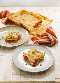 Summer moussaka with chickpeas on a light yellow background