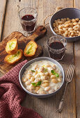 Creamy white beans with herb crostini