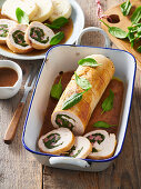 Stuffed turkey roll with smoked meat and spinach