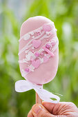 Pink cake lolly with bow