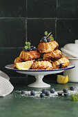 Mini lemon bundt cake with ricotta and blueberries cooked in a hot air fryer