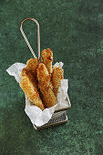 Breaded pickles cooked in a hot air fryer